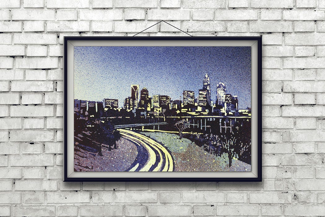 Sunset skyline painting of Charlotte in vivid watercolor tones, perfect for travel-themed interiors.