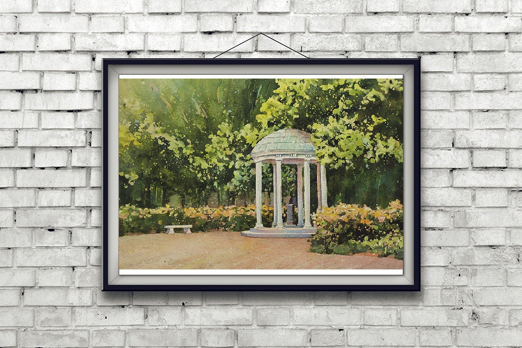 A calming watercolor of UNC’s Old Well under a bright Carolina sky, ideal as a graduation keepsake, alumni wall art, or fine art gift print.