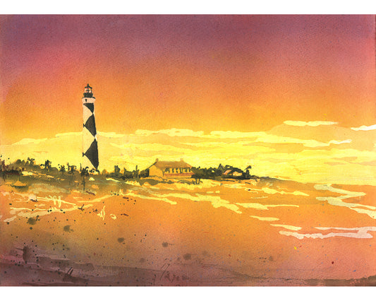 Hand-painted watercolor of Cape Lookout Lighthouse in North Carolina's Outer Banks, featuring vibrant blues and sandy shore—perfect coastal wall art for beach house decor or nautical-themed interiors