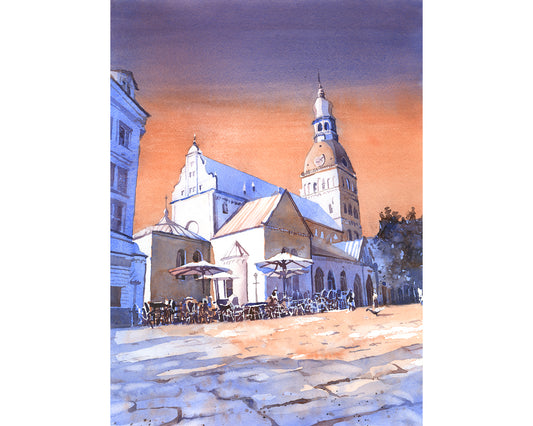 A peaceful city square in soft morning light, this Cityscape Latvia Riga fine art watercolor landscape painting (print) features the iconic dome of Riga Cathedral, historic buildings, and café tables under umbrellas, all rendered in delicate hues of blue and amber.