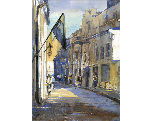 Watercolor painting of historic European street scene with soft blue shadows, sunlit buildings, pedestrians, and hanging flag cityscape