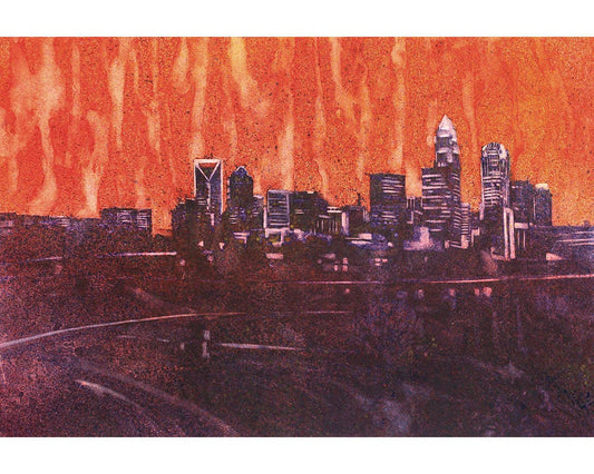 Vibrant watercolor painting of the Charlotte, North Carolina skyline glowing at sunset.