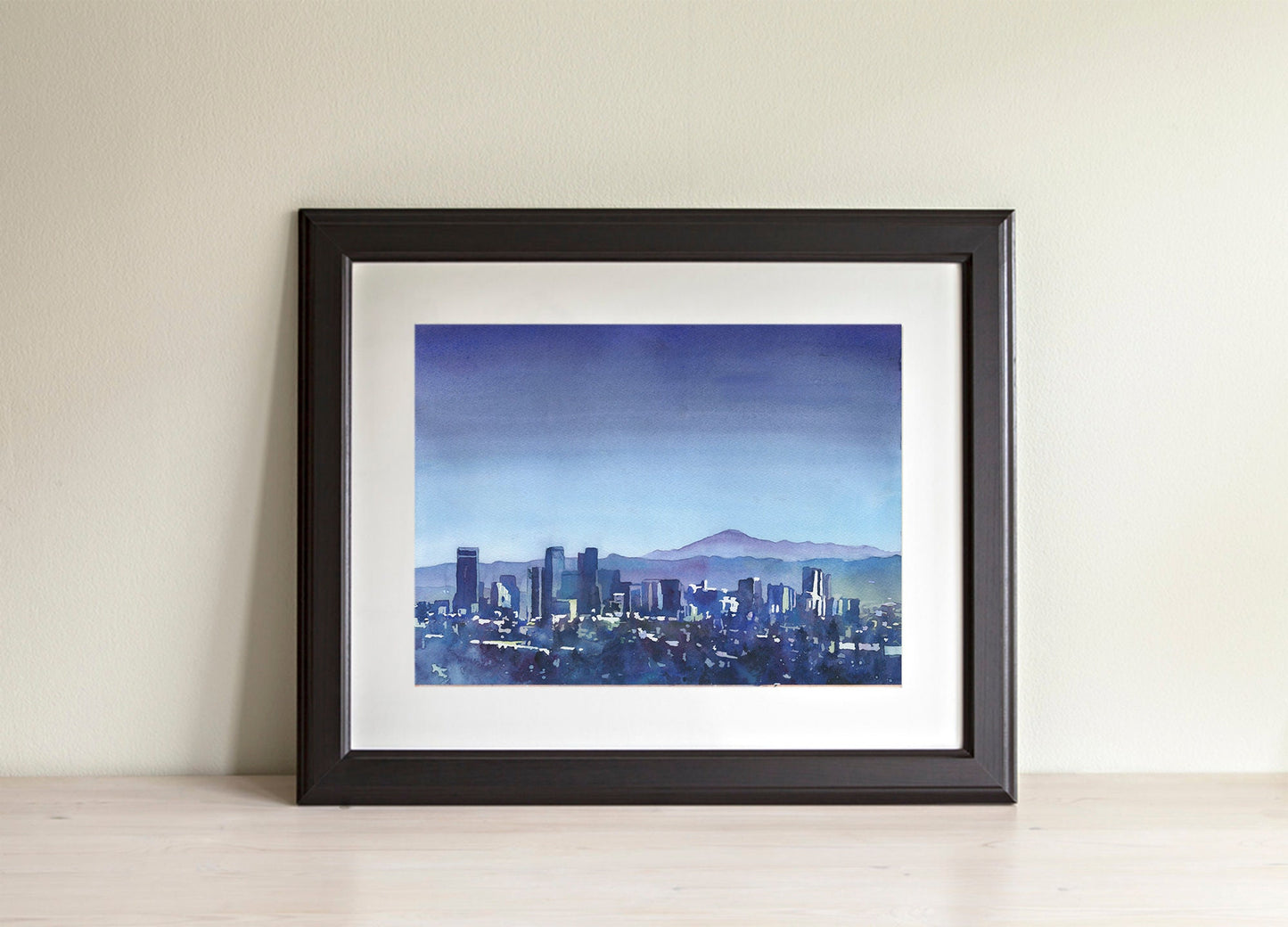 Denver, Colorado skyline at dusk with mountains in background.  Denver CO skyline blue watercolor art Denver city artwork blue landscape art (print)